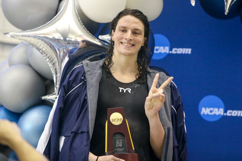 Mar 17, 2022; Atlanta, Georgia, USA; Penn Quakers swimmer Lia Thomas holds a trophy after finishing first in the 500 free at the NCAA Womens Swimming & Diving Championships at Georgia Tech. Mandatory Credit: Brett Davis-USA TODAY Sports