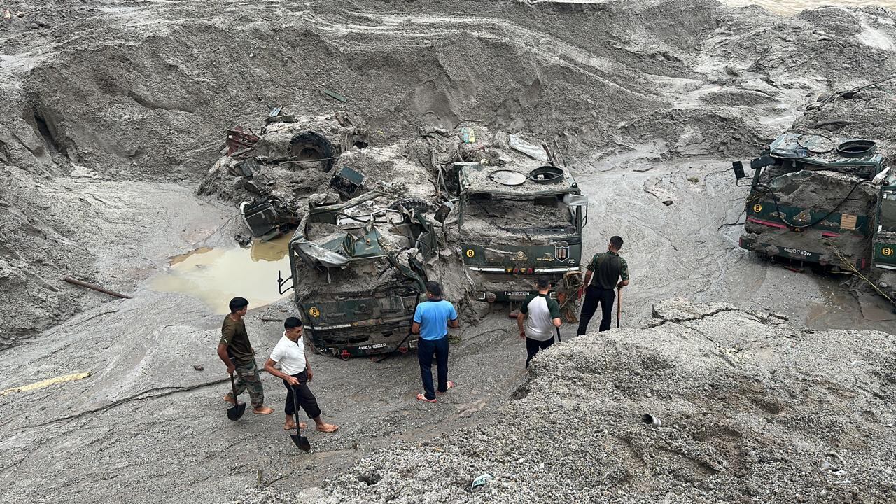 Members of Indian Army try to recover trucks buried at the area affected by flood in Sikkim in this undated image released by the Indian Army on October 5, 2023.