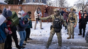 MINNEAPOLIS, MN. - JANUARY 2026: A Border Patrol Tactical Unit agent sprays pepper spray into the face of a protestor attempting to block an immigration officer vehicle from leaving the scene where a woman was shot and killed by a federal agent earlier, in Minneapolis, Minn. on Wednesday, January 7, 2026. The Department of Homeland Security confirmed that a woman was shot and killed by an Immigration and Customs Enforcement (ICE) agent during a confrontation between federal agents and protesters in south Minneapolis. (Photo by Alex Kormann/The Minnesota Star Tribune via Getty Images)