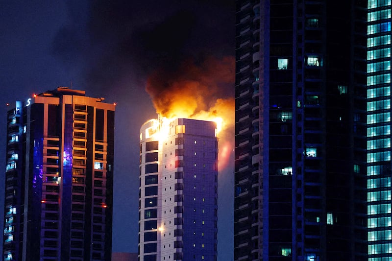 Smoke rises from a burning building hit by an Iranian drone strike, after Israel and the U.S. launched strikes on Iran, in Seef district, Manama, Bahrain, Feb. 28, 2026.