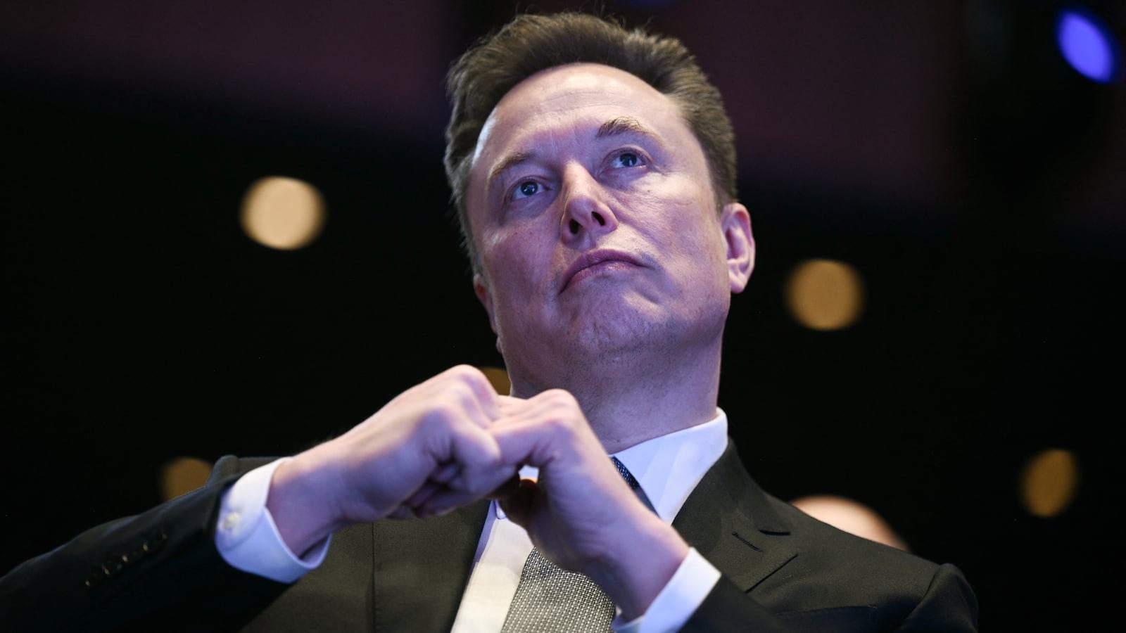 Elon Musk looks on as US President Donald Trump speaks at the US-Saudi Investment Forum at the John F. Kennedy Center for the Performing Arts in Washington, DC on November 19, 2025. (Photo by Brendan SMIALOWSKI / AFP) (Photo by BRENDAN SMIALOWSKI/AFP via Getty Images)