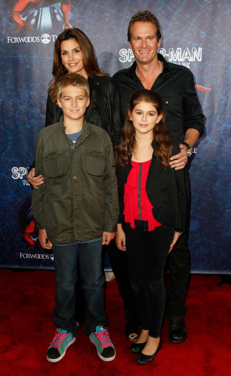 Model Cindy Crawford, her husband Rande Gerber, and their children, Presley Walker Gerber  (front L) and Kaia Jordan Gerber, arrive at the Broadway opening of "Spider-Man: Turn Off The Dark" in New York June 14, 2011. REUTERS/Jessica Rinaldi (UNITED STATES - Tags: ENTERTAINMENT)