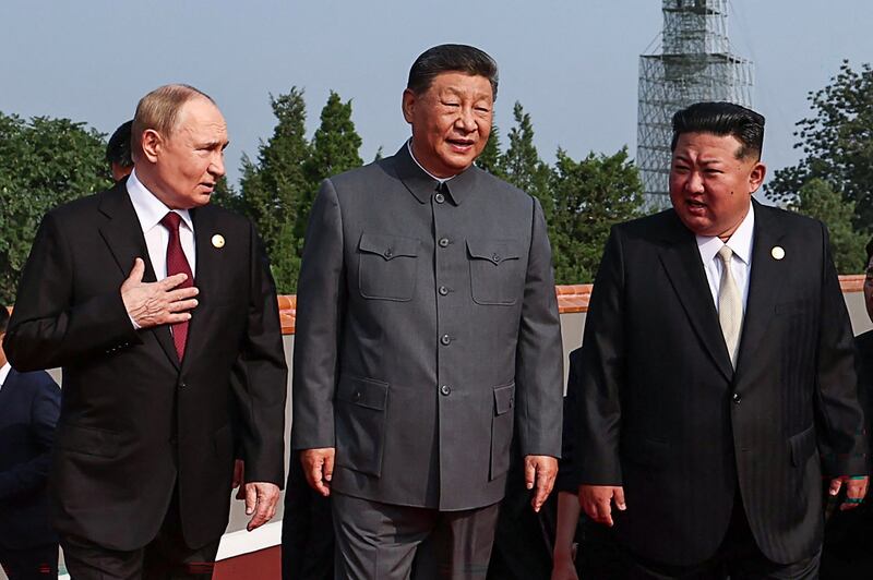 TOPSHOT - In this pool photograph distributed by the Russian state agency Sputnik, (L-R) Russia's President Vladimir Putin walks with China's President Xi Jinping and North Korea's leader Kim Jong Un before a military parade marking the 80th anniversary of victory over Japan and the end of World War II, in Beijing's Tiananmen Square on September 3, 2025. (Photo by Alexander KAZAKOV / POOL / AFP) (Photo by ALEXANDER KAZAKOV/POOL/AFP via Getty Images)