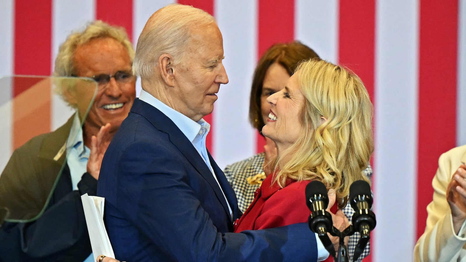 U.S. President Joe Biden speaks with Kerry Kennedy during a campaign in April in Philadelphia