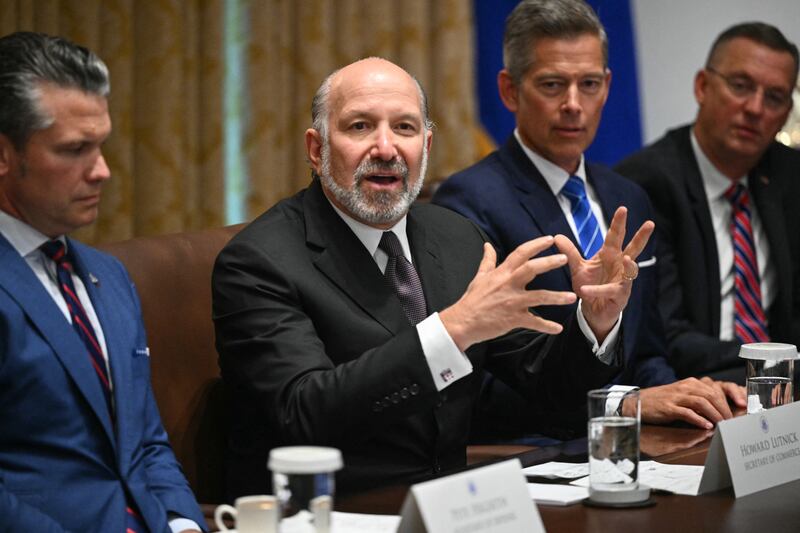 US Secretary of Commerce Howard Lutnick (2L) speaks during a cabinet meeting with US President Donald Trump in the Cabinet Room of the White House in Washington, DC, on August 26, 2025. Also pictured, L/R, are Secretary of Defense Pete Hegseth, Secretary of Transportation Sean Duffy, and Secretary for Veterans Affairs Doug Collins. (Photo by Mandel NGAN / AFP) (Photo by MANDEL NGAN/AFP via Getty Images)