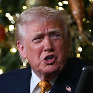 US President Donald Trump participates in NORAD Santa tracker phone calls, on Christmas Eve, from the Mar-a-lago club in Palm Beach, Florida, on December 24, 2025. (Photo by ANDREW CABALLERO-REYNOLDS / AFP via Getty Images)