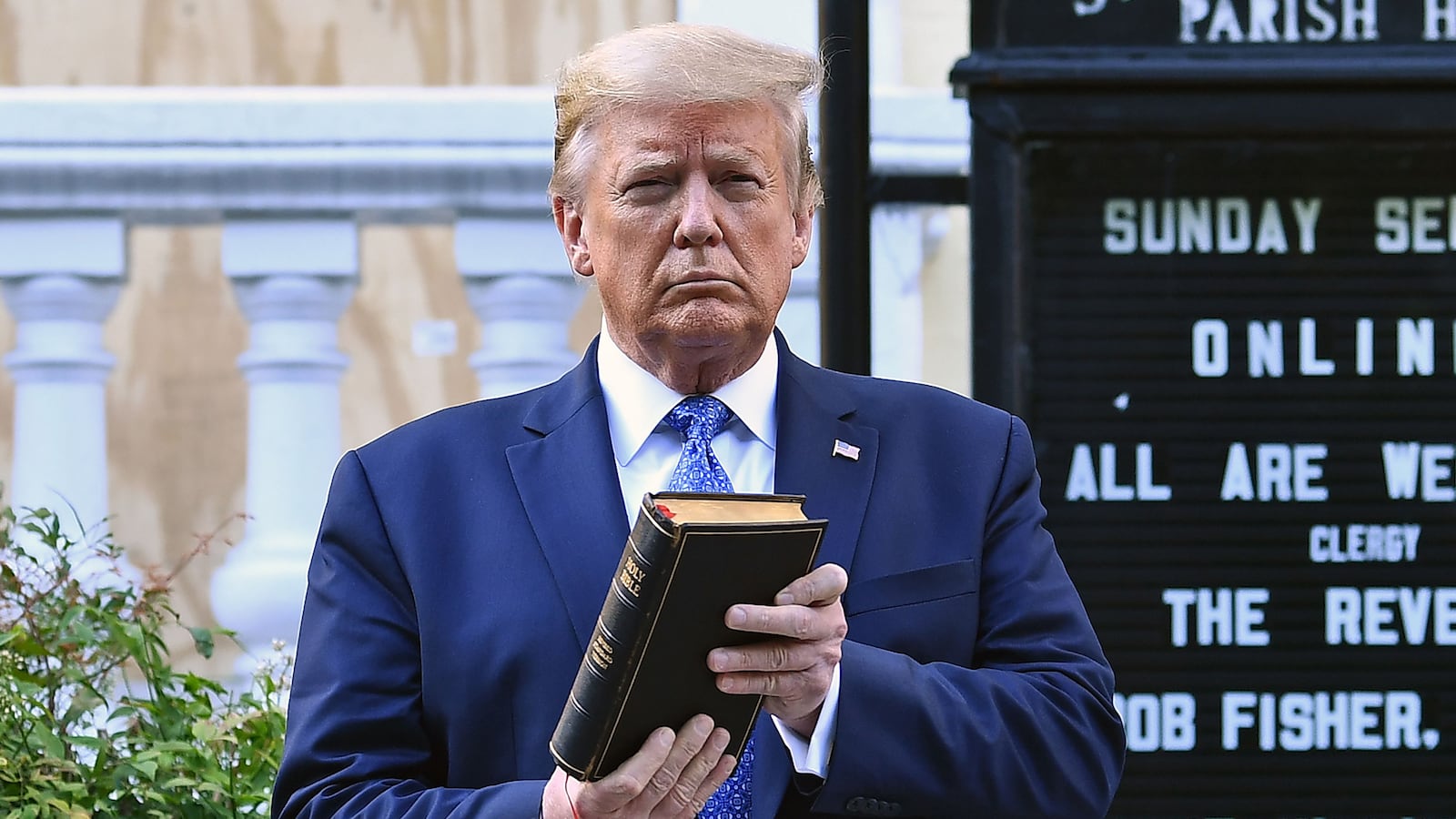US President Donald Trump holds up a Bible outside of St John's Episcopal church across Lafayette Park in Washington, DC on June 1, 2020.