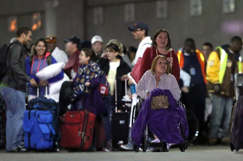 galleries/2013/02/15/carnival-cruise-liner-triumph-docks-in-alabama-passengers-celebrate-return-home-photos/triumph-cruise-6_l2wyir