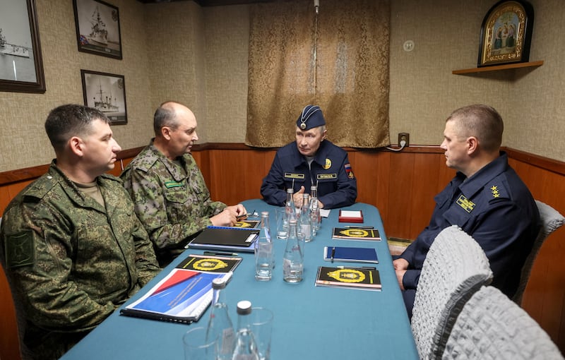 Russian President Vladimir Putin chairs  a meeting on board the missile cruiser “Varyag” as he observes a military drill of the Pacific fleet, in Russia's far eastern Sakhalin Region, Russia, August 13, 2026.