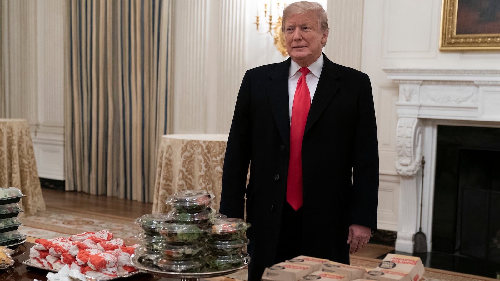 President Donald Trump presents fast food to be served to the Clemson Tigers in celebration of their national championship at the White House on January 14, 2019 in Washington, DC. Clemson won their second title in three years after beating Alabama 44-16 on January 7th.