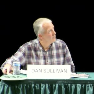 Senator Dan Sullivan takes a glance at his opponent's answer before responding.