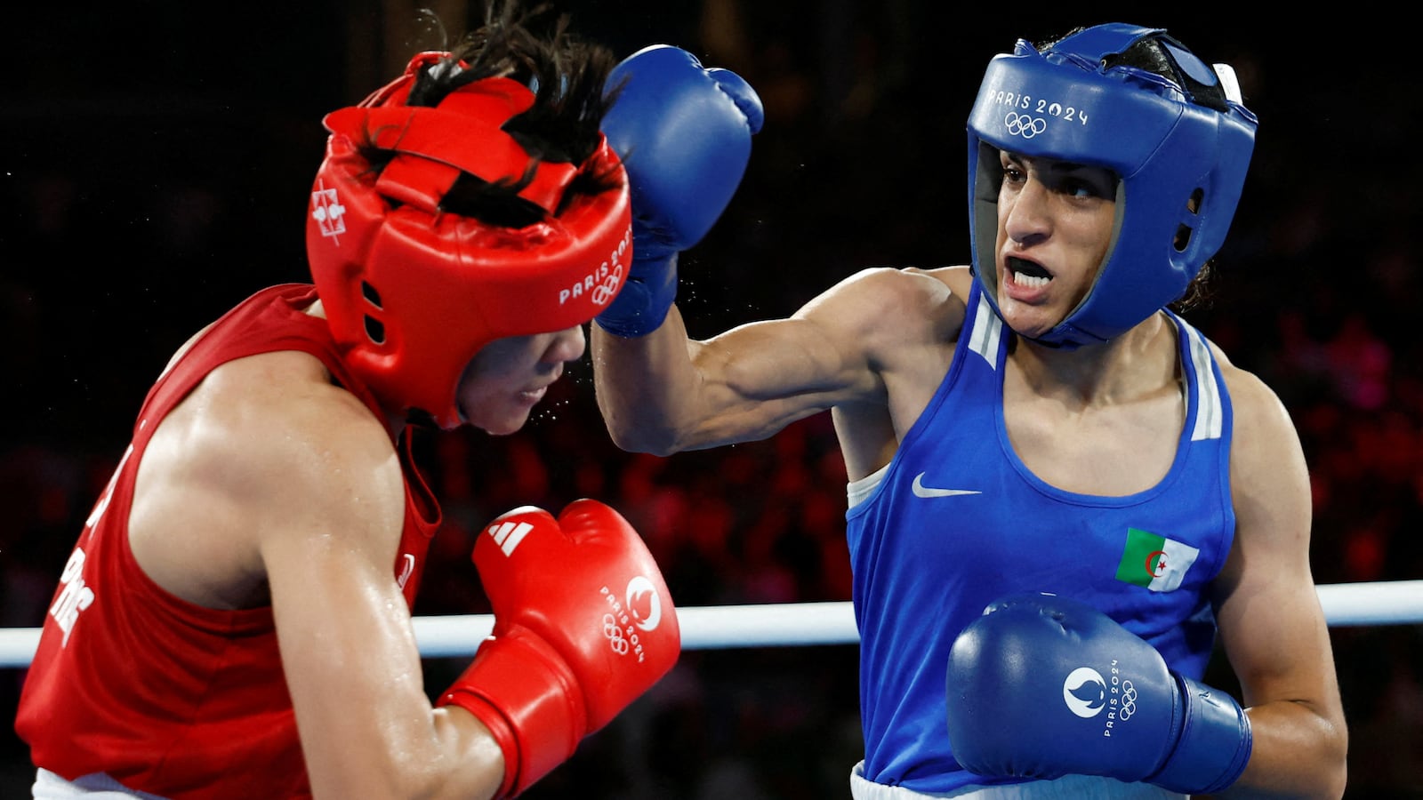 Imane Khelif of Algeria in action against Janjaem Suwannapheng of Thailand.