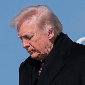 U.S. President Donald Trump disembarks Air Force One as he arrives at Joint Base Andrews, Maryland, U.S., March 18, 2026.