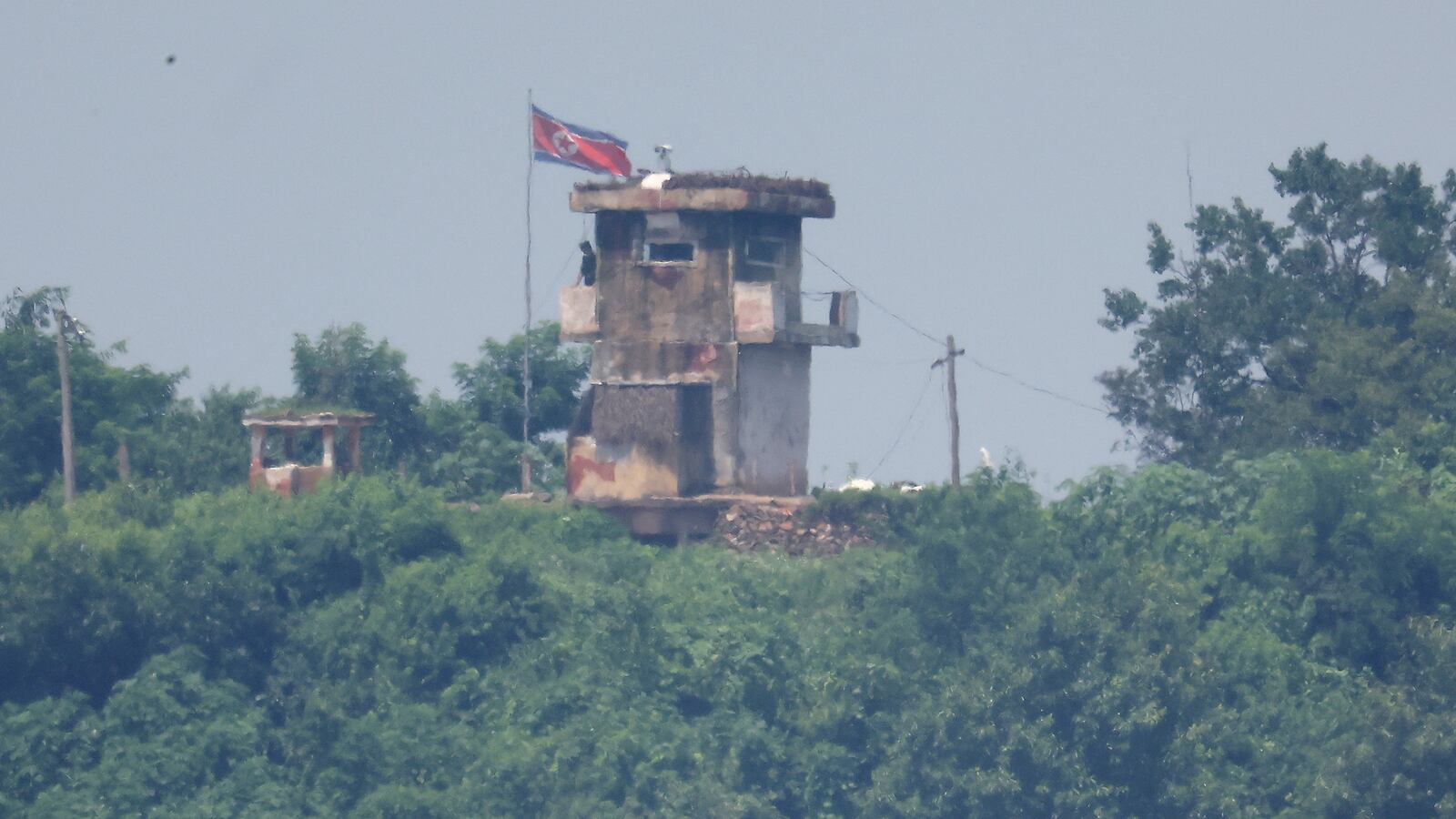 A North Korean soldier stands guard at their guard post in this picture taken near the demilitarized zone separating the two Koreas, in Paju, South Korea, July 19, 2023.