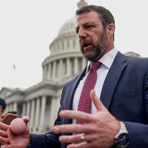 U.S. Senator Markwayne Mullin (R-OK), tapped by U.S. President Donald Trump to replace U.S. Homeland Security Secretary Kristi Noem, holds a rubber ball while speaking to members of the media as he departs the U.S. Capitol after a vote in the U.S. Senate on funding for DHS, in Washington, D.C., U.S., March 5, 2026.