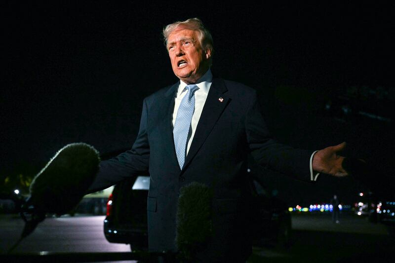US President Donald Trump speaks with reporters before boarding Air Force One as he departs Palm Beach International Airport in West Palm Beach, Florida, on November 16, 2025. Trump is returning to the White House after spending the weekend at his Mar-a-Lago, Florida, residence. (Photo by Jim WATSON / AFP) (Photo by JIM WATSON/AFP via Getty Images)