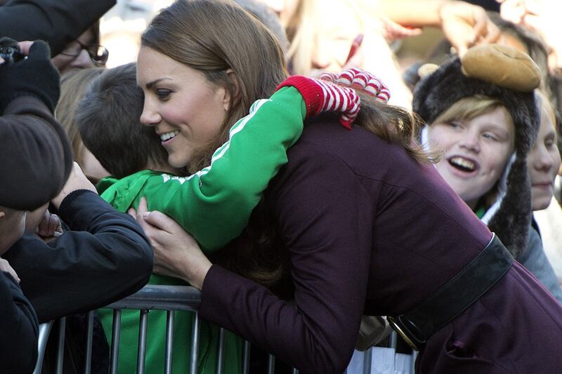 articles/2012/10/10/kate-wears-coat-from-last-christmas-on-solo-newcastle-visit/kate-hug_v2uchi