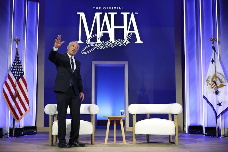 U.S. Secretary of Health and Human Services Robert F. Kennedy Jr. waves during a discussion at The Official MAHA Summit at Waldorf Astoria Hotel on November 12, 2025 in Washington, DC.