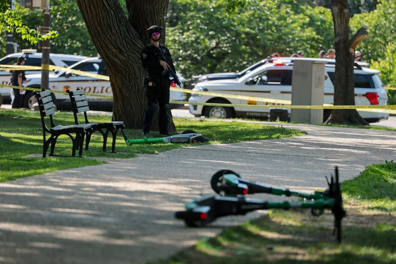 A law enforcement officer stands watch at the scene of an officer-involved shooting in Washington, D.C. on May 4, 2026.