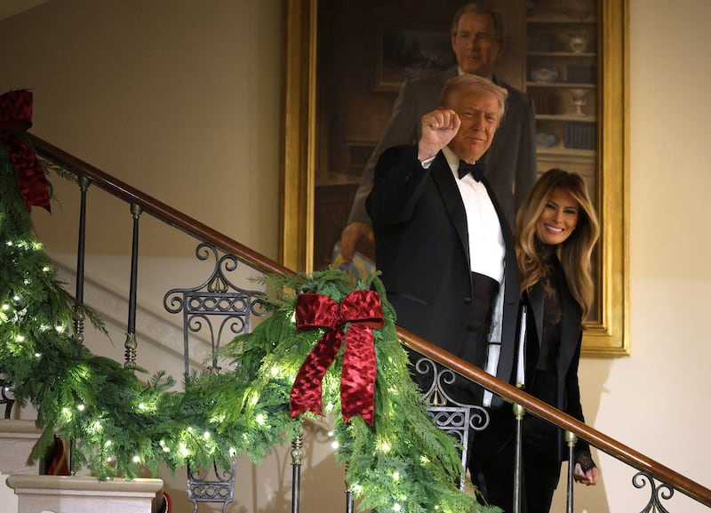 President Donald Trump and first lady Melania Trump arrive at the Congressional Ball at the Grand Foyer of the White House on December 11, 2025 in Washington, DC.