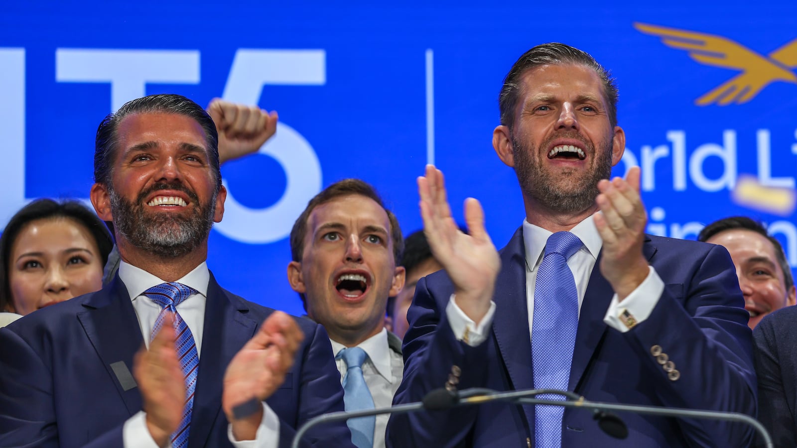 Zach Witkoff flanked by Eric Trump and Donald Trump Jr. in August.