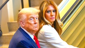 Melania Trump looks back at U.S. Donald Trump before walking up the escalator after arriving for the 80th session of the UN’s General Assembly (UNGA) on September 23, 2025 in New York City.