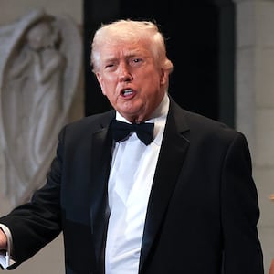 President Donald Trump and first lady Melania Trump arrive for a New Year’s Eve event at his Mar-a-Lago home on December 31, 2025 in Palm Beach, Florida. The president called in to Fox & Friends on January 3  to brag about watching the strikes on Venezuela from his club.