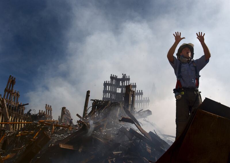 A New York City fireman calls for more rescue workers to make their way
into the rubble of the World Trade Center September 15, 2001.