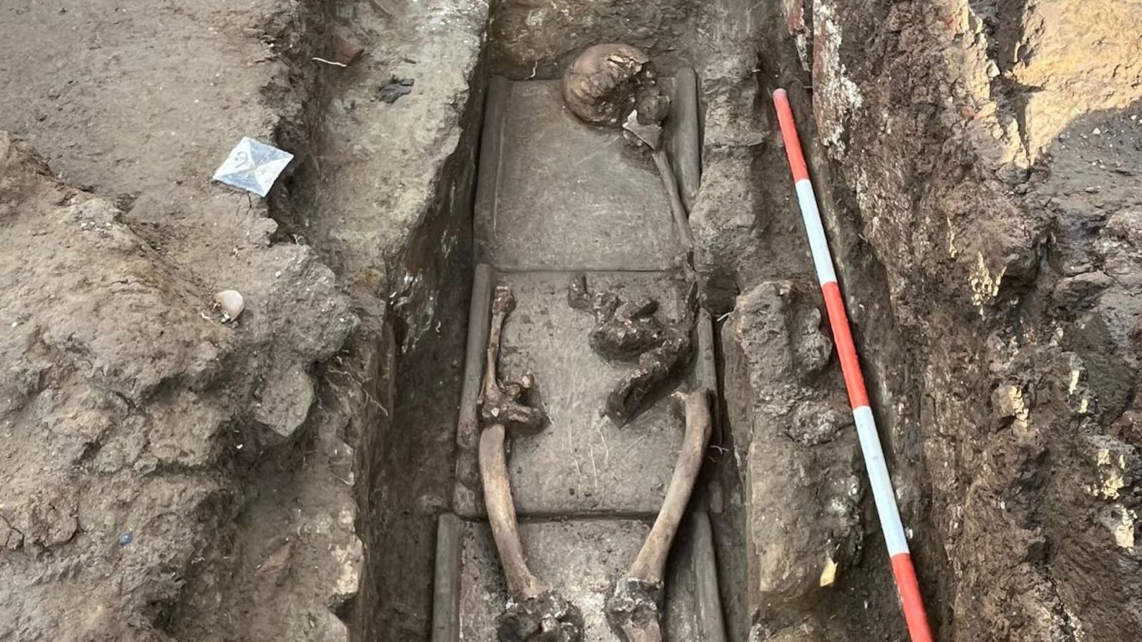 Bones lay at the bottom of a grave excavated near Naples.