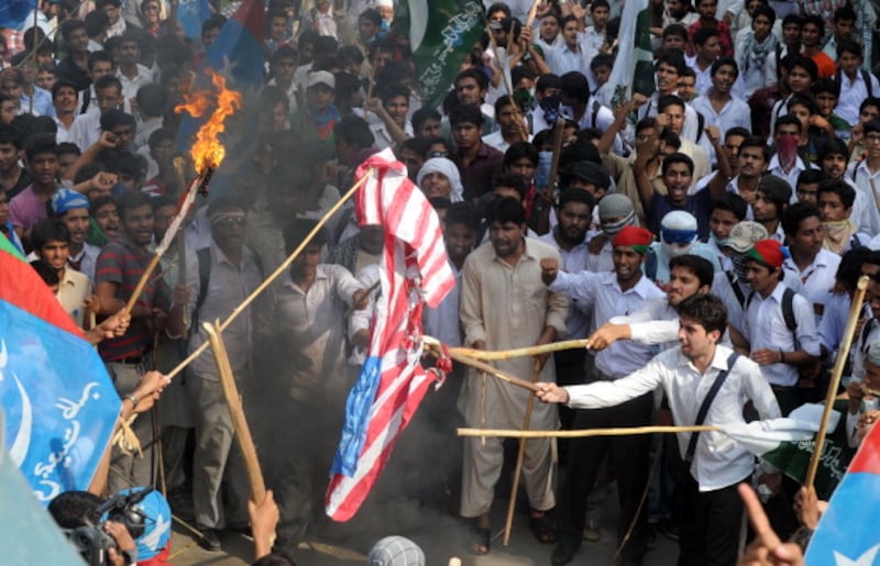 articles/2012/09/19/in-pakistan-it-s-blasphemy-if-you-don-t-riot/pakistan-protests-flag_iobosq