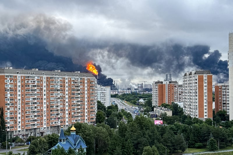 TOPSHOT - Black smoke rises from the area of the Russian oil producer Gazprom Neft's Moscow oil refinery on the south-eastern outskirts of Moscow on June 18, 2026. Moscow was fending off a "large-scale" drone attack from Ukraine, with several drones reaching an oil refinery, the city's mayor Sergey Sobyanin said early on June 18, 2026. (Photo by AFP via Getty Images)