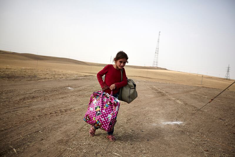galleries/2014/06/16/thousands-flee-violence-in-iraq-photos/140616-iraq-refugees-1_apvhrj