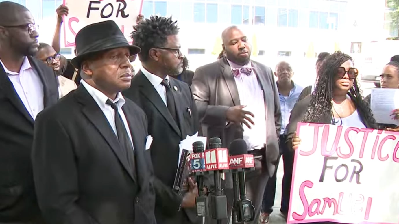The family of Samuel Lawrence hold a press conference outside the Fulton County Jail.