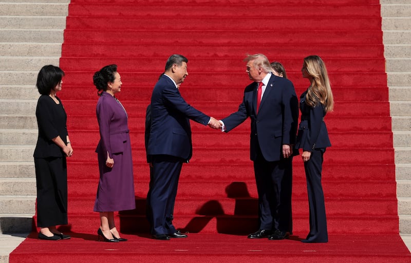 US President Donald Trump and Chinese President Xi Jinping shake hands alongside US first lady Melania Trump and Chinese President Xi Jinping's wife Peng Liyuan, after arriving to tour the National Archives Museum in Washington, D.C., US, September 25, 2026. REUTERS/Kylie Cooper