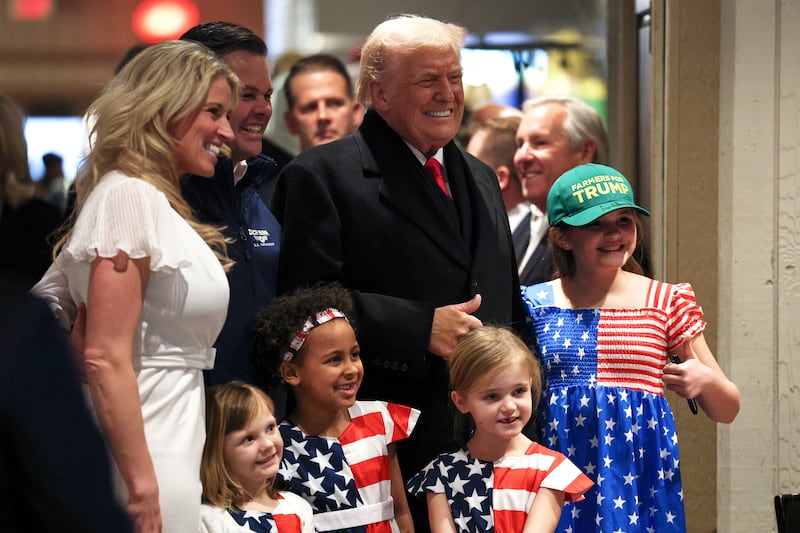 URBANDALE, IOWA - JANUARY 27: U.S. President Donald Trump poses with U.S. Rep. Zach Nunn (R-IA) and his wife Kelly Nunn as he visits the Machine Shed restaurant on January 27, 2026 in Urbandale, Iowa. President Trump is scheduled to speak later at the Horizon Events Center in Clive, Iowa. He returns to Iowa for a second time in his second term ahead of the mid-term elections. (Photo by Win McNamee/Getty Images)