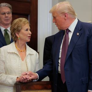 U.S. President Donald Trump speaks with Secretary of Education Linda McMahon