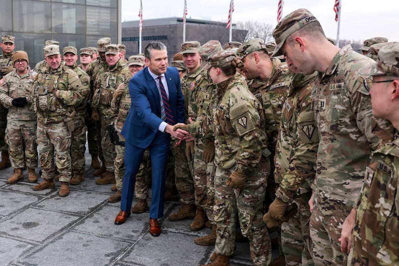 U.S. Defense Secretary Pete Hegseth greets U.S. Army National Guard soldiers after administering their oath during a re-enlistment ceremony at the base of the Washington Monument in Washington, D.C., U.S., February 6, 2026.