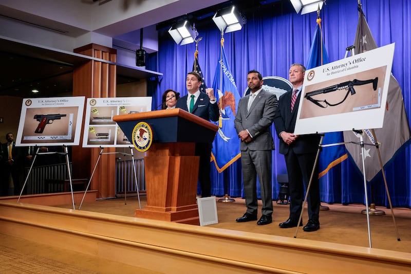 Pictures of the weapons carried by Cole Tomas Allen, the suspect in the shooting incident in Washington at the annual White House Correspondents' Association dinner, are displayed as U.S. Attorney for the District of Columbia Jeanine Pirro, Acting Attorney General Todd Blanche, U.S. Federal Bureau of Investigation (FBI) Director Kash Patel and Assistant Director in Charge (ADIC) of the FBI Washington Field Office Darren Cox take part in a press conference at the U.S. Department of Justice about the shooting incident, in Washington, D.C., on April 27, 2026.