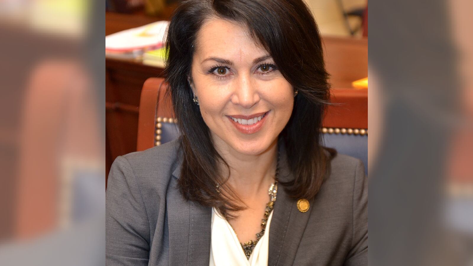 A headshot of Deidre Henderson smiling and facing forward.