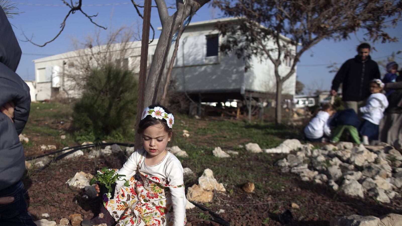 articles/2012/05/04/the-cost-of-migron/migron-child-openz_yzgnvj