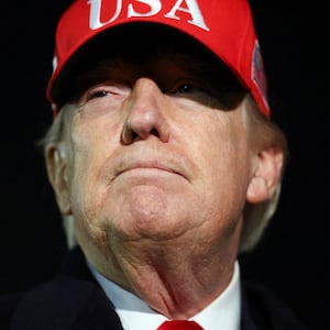 President Donald Trump looks on after disembarking Air Force One as he arrives at Joint Base Andrews in Maryland, U.S., April 12, 2026.