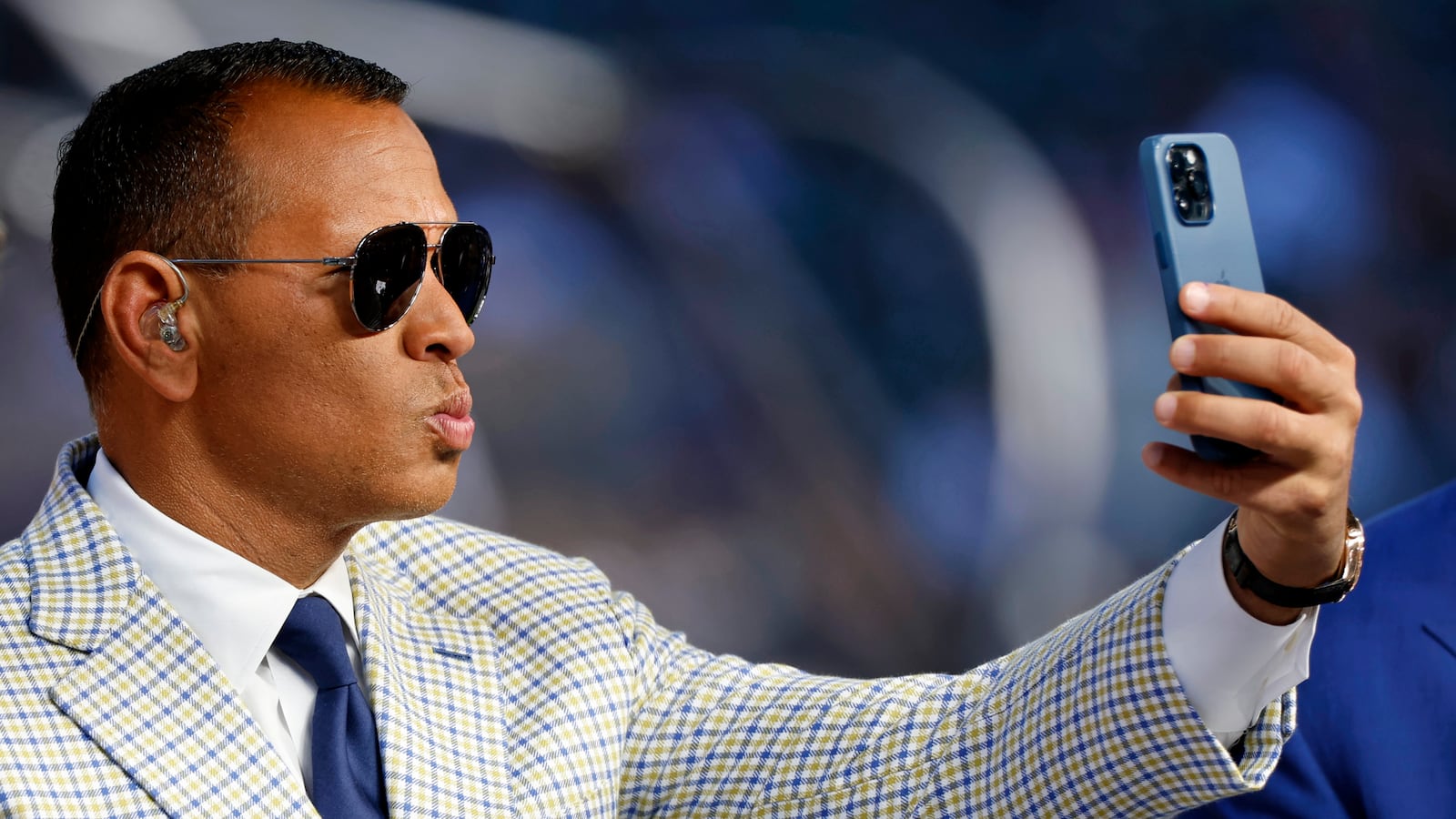 Alex Rodriguez making a duck face with his lips while taking a selfie.