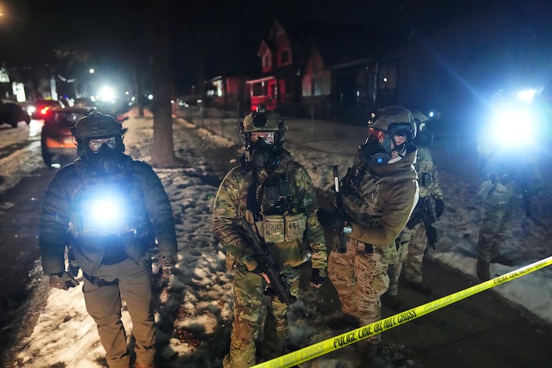 Law enforcement officers at the scene of a reported shooting Wednesday, Jan. 14, 2026, in Minneapolis.