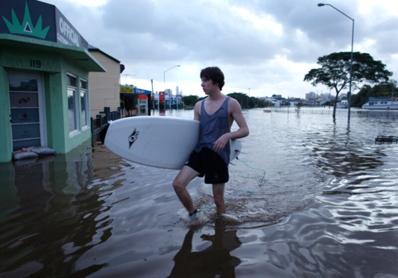 galleries/2011/01/14/flood-waters-recede-in-brisbane/australia-floods---surfer_gxaxm7