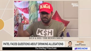 Kash Patel with a beer