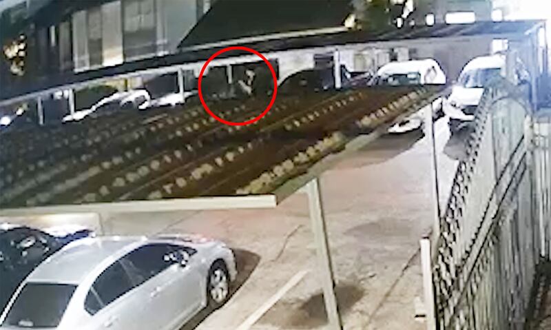 A surveillance video screen grab that appears to show Abdul Rahman Waziri at a parking lot near his apartment before the shooting.