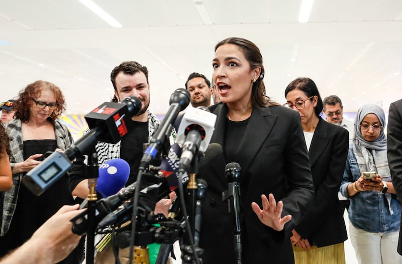 US Representative Alexandria Ocasio-Cortez, Democrat of New York, speaks to the press next to former Columbia University student Mahmoud Khalil as he is greeted by family and friends upon arrival at Newark airport in Newark, New Jersey, on June 21, 2025. Mahmoud Khalil, a former Columbia University student who was one of the most visible leaders of nationwide pro-Palestinian campus protests, was released on June 20 from a federal detention center. Khalil, a legal permanent resident in the United States who is married to a US citizen and has a US-born son, has been in custody since March facing potential deportation.