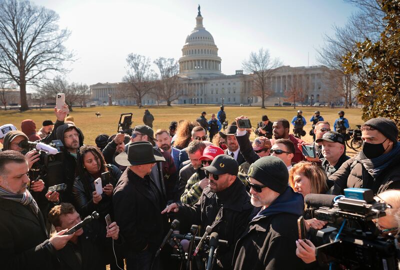 WASHINGTON, DC - FEBRUARY 21: Members of the far-right group the Proud Boys, including their former leader Enrique Tarrio, Stewart Rhodes, Joe Biggs, Ethan Nordean and Zach Rehl speak to journalists on the east side of the U.S. Capitol on February 21, 2025 in Washington, DC. The news conference was held in the same area where thousands of supporters of President Donald Trump stormed the U.S. Capitol on January 06, 2021 in an attempt to halt the certification of former President Joe Biden's election victory. In one of the first acts of his second term, Trump pardoned nearly 1,600 people charged and convicted of crimes related to the attack. (Photo by Chip Somodevilla/Getty Images)