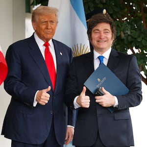 WASHINGTON, DC - OCTOBER 14: U.S. President Donald Trump (L) greets President of Argentina Javier Milei as he arrives at the West Wing of the White House on October 14, 2025 in Washington, DC. Trump is hosting Milei for a working lunch days after the U.S. Treasury finalized a $20 billion currency swap framework with Argentina in an effort to help stabilize its economy. (Photo by Kevin Dietsch/Getty Images)
