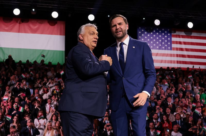 U.S. Vice President JD Vance and Hungarian Prime Minister Viktor Orban shake hands on stage during Day of Friendship event at MTK Sportpark in Budapest, Hungary, April 7, 2026. REUTERS/Jonathan Ernst/Pool     TPX IMAGES OF THE DAY